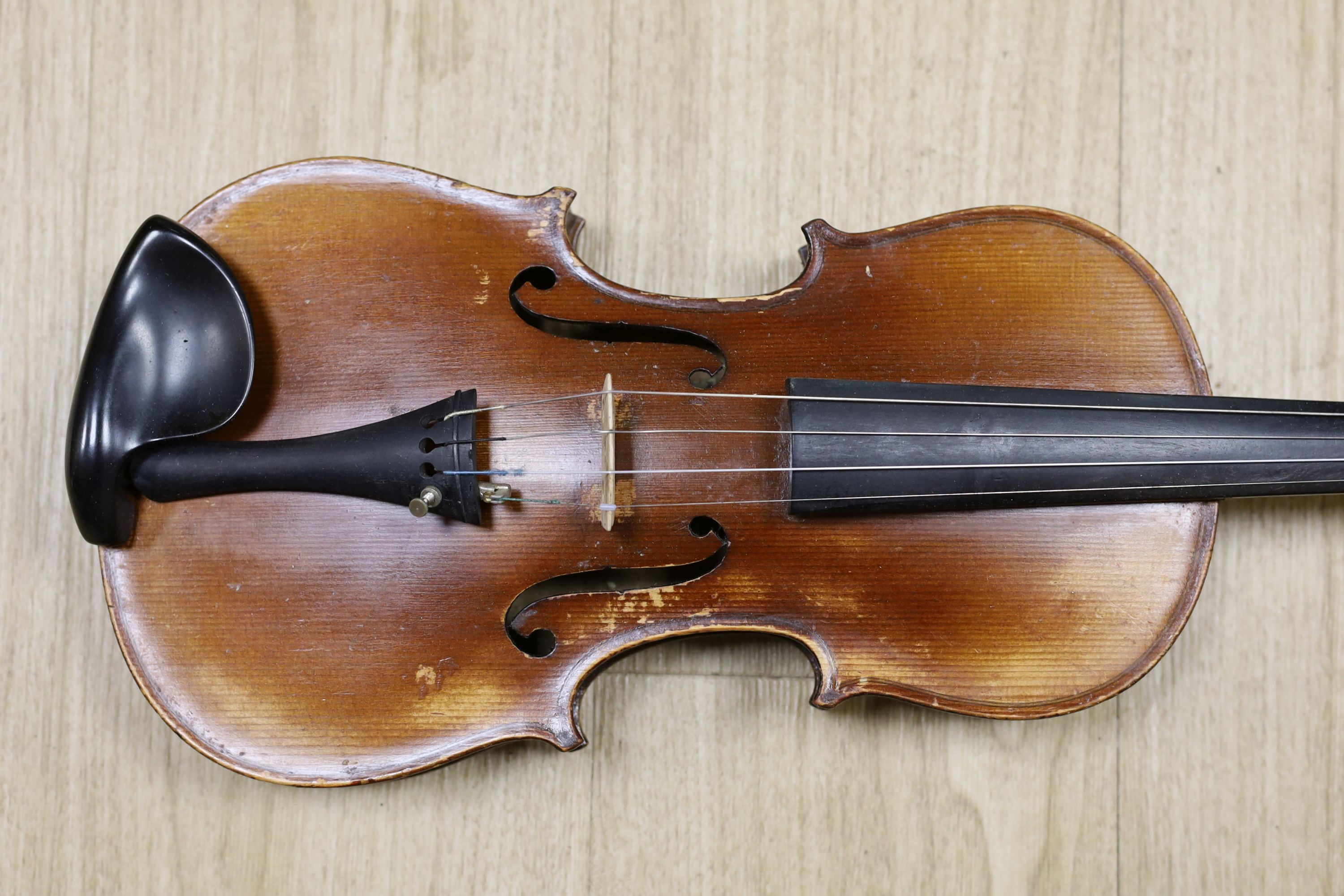 A cased violin, with bow